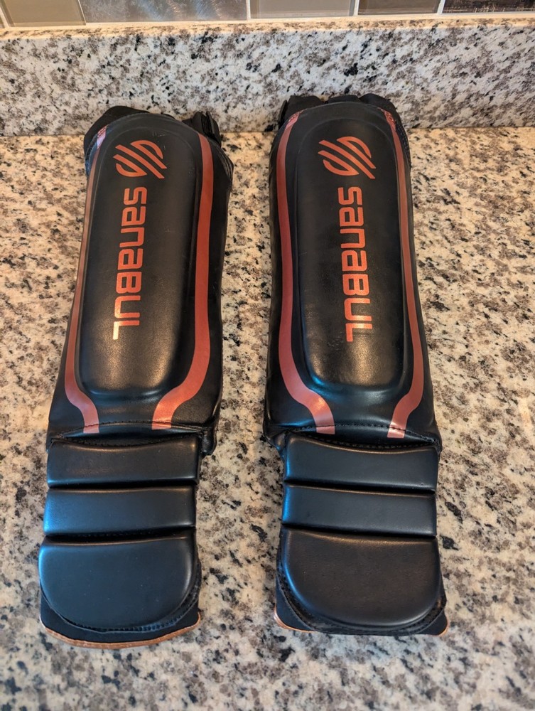 Sanabul Shin Guards Essential Hook & Loop XS Black Copper Kickboxing MMA 2541D